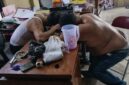 Foto : kedua Perangkat Desa yang Tepar karena mabuk berat di kantor